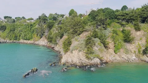 Aerial view of the rugged coastal cliffs of Binic along the Emerald Coast in Stock Footage 346665488