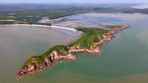 Aerial view of rugged coastline with green hills Stockbeeldmateriaal 333041753