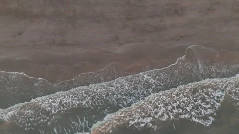 Aerial view of a rugged mountain ridge covered with light snow in winter. Stock Footage 339065648