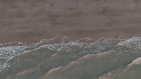 Aerial view of a rugged mountain ridge covered with light snow in winter. Stock Footage 339065890