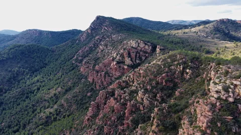 Aerial view of rugged red cliffs at Mirador de Garbi, Video stock 326034534