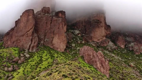 Aerial view of rugged rock formations shrouded in mist, United States. Video stock 333570068