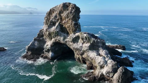 Aerial View of a Rugged Yet Beautiful Sea Stack Off the Scenic Coast of Oregon Stock Footage 283754564