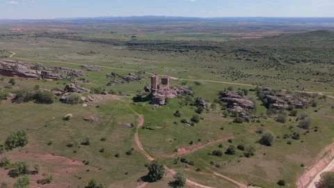 Aerial view of a ruined medieval tower on rocky outcrop 스톡 동영상 343325844