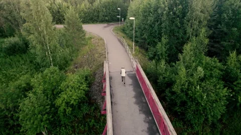 Aerial view of runner on bridge Stock Footage 278733053