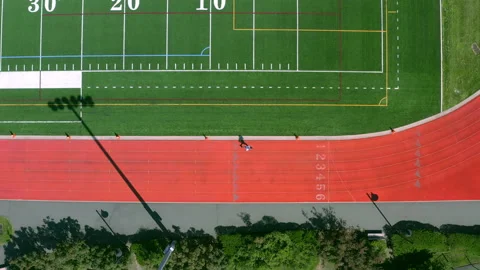 Aerial view of runner training in track and field 4K Stock Footage 137963974