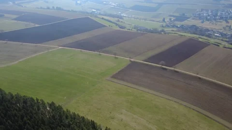 Aerial view of rural farmland, fields and country roads on sunny day Stock Footage 331248522