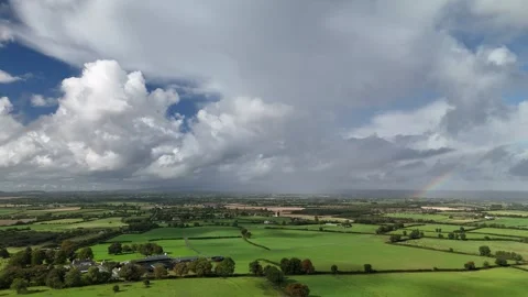 Aerial View of Rural Fields with Small Rainbow in 4K Stockbeeldmateriaal 333337481