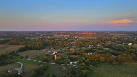 Aerial view of a rural landscape field grass in sunset Akron Ohio Stock Footage