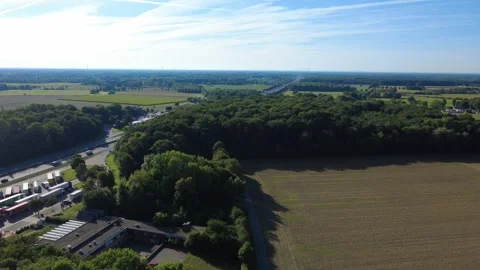 Aerial view of rural landscape with fields and forest under blue sky Stock Footage 327328172