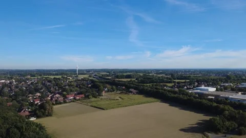 Aerial view of rural landscape with fields and forest under blue sky Stock Footage 327328356