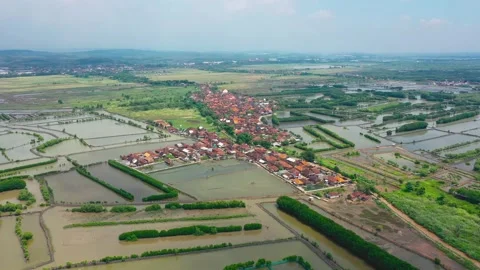 Aerial view of a rural landscape with patchwork fields and a small village Stock-Footage 267078374