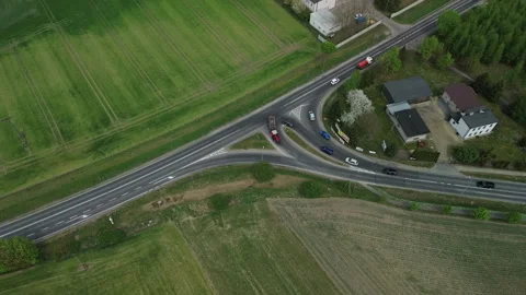 Aerial view of rural road intersection with traffic movement – 4K ProRes Stock Footage 334332447