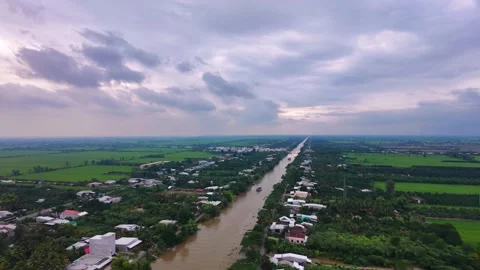 Aerial View of Rural Settlement Along Straight Canal in Southwestern Vietnam Vídeos de archivo 343606689
