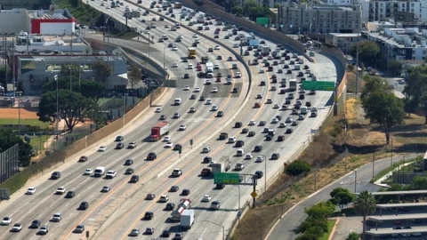Aerial view of rush hour traffic on interstate 405, sunny day in Los Angeles Stock Footage 293558246