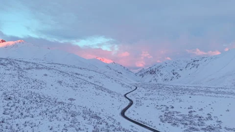Aerial View of Ruta 40 Through Snowy Andes at Sunrise in Patagonia Stock Footage 338390233