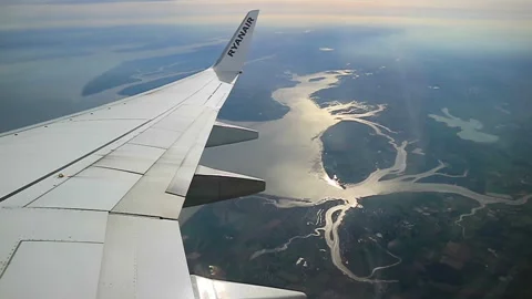 Aerial View From Ryanair Plane Over Mediterranean Salt Flats and Coastal Lagoons Stock Footage 335454755