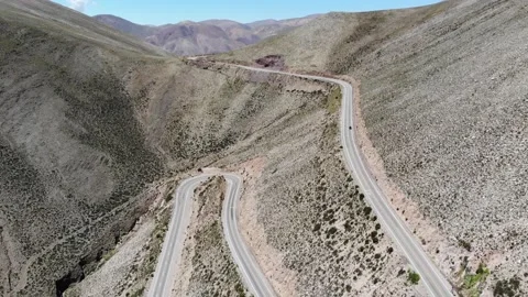 Aerial View Of The Saddle Between The Mountains With A Hairpin Turning Road Stock Footage 191763875