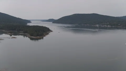 Aerial View of Sailboat Pulling into Harbor Stock Footage 95792881