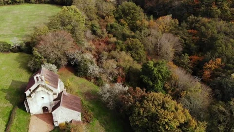 Aerial view of Saint Mayeul chapel hidden in Troncais forest, Vitray, France Stock Footage 341884839