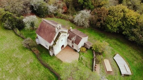 Aerial view of Saint Mayeul chapel hidden in Troncais forest, Vitray, France Stock Footage 341884875