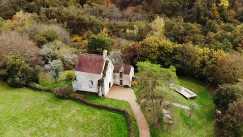 Aerial view of Saint Mayeul chapel hidden in Troncais forest, Vitray, France Stock Footage 341884928