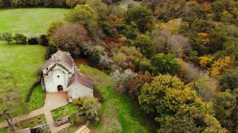 Aerial view of Saint Mayeul chapel hidden in Troncais forest, Vitray, France Stock Footage 341884968