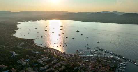 Aerial view of Saint-Tropez during sunset. St. Drone flies over the harbor of Stock Footage 219697516