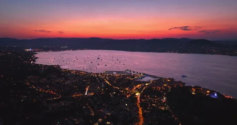 Aerial view of Saint-Tropez during sunset. St. Drone flies over the harbor of Stock Footage 220327489