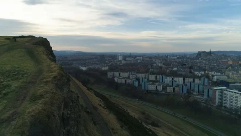 Aerial view from Salisbury Crags cliffs overlooking Edinburgh, drone aerial 4K Stock Footage 101218729