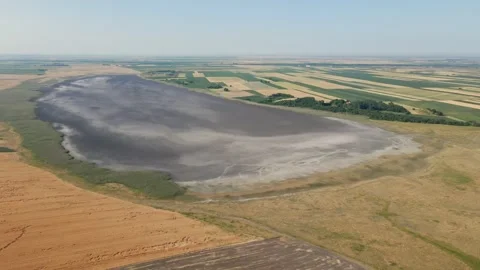 Aerial View of Salt Lake with Fields Stretching to the Horizon Stock Footage 255818930