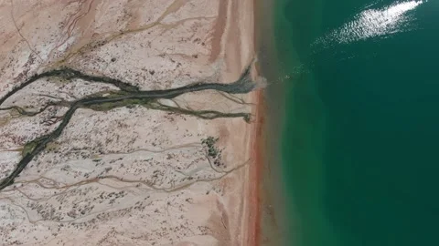 Aerial View | Salt River Flows into Dead Sea, Jordan Stock Footage 141744464