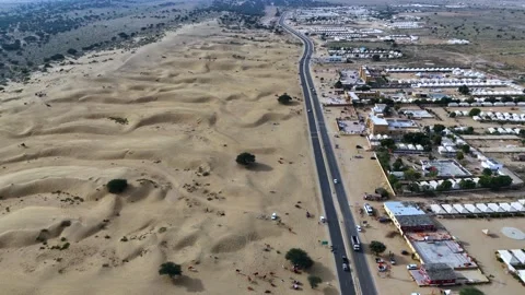 Aerial View of Sam Sand Dunes and Desert Resorts in Jaisalmer Stock Footage 332886517