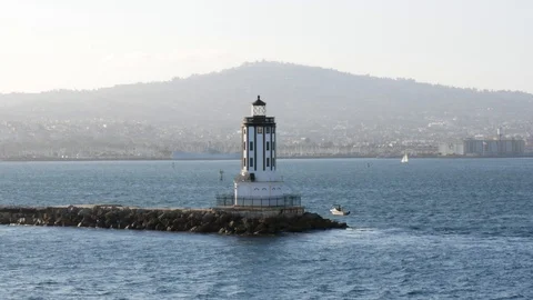 Aerial view of San Pedro Harbor Lighthouse during beautiful Sunset hour Stock Footage 122010576