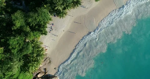Aerial view of sand beach. Looping ocean texture, Top view sea waves slow mot Stock Footage 107477761