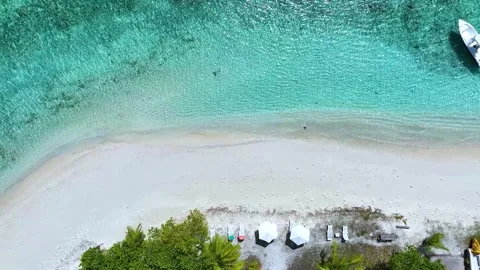Aerial view with sand beach in wave of turquoise sea water shot seashore Video stock 240196090