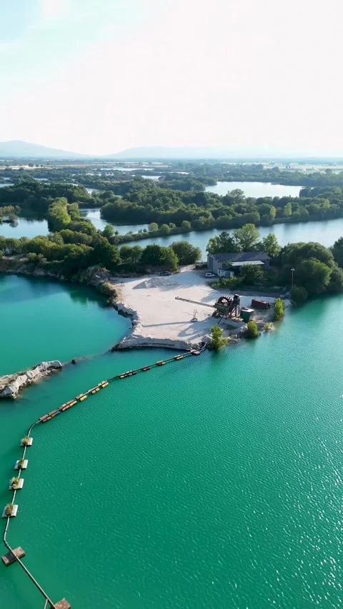 Aerial view of sand dredging operation in a quarry lake Stock Footage 339321519