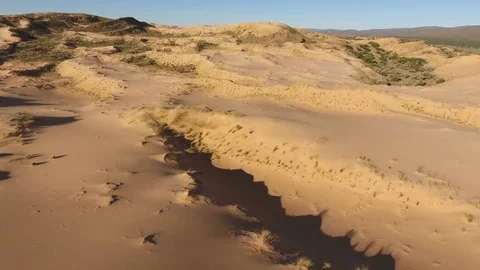 Aerial view of sand dunes in the arid region of the Northern Cape, South Africa Stock Footage