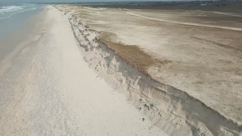 Aerial view of sand dunes by the ocean and sea Stock Footage 212342018