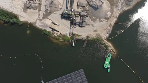 Aerial view of sand mining quarry and floating solar panels Stock Footage 341874311
