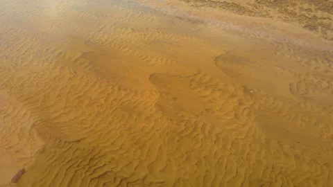Aerial View Sand Patterns on Pond Bottom. Shallow water reveals texture of sand, Vidéo 303493326