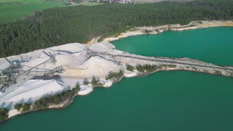 Aerial View of Sand Quarry with Blue Water and Forest in Germany Stock Footage 313219048