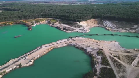 Aerial View of Sand Quarry with Blue Water and Forest in Germany Stock Footage 313220342