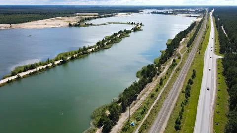 Aerial view sand quarry mining road artificial lakes Stock Photos