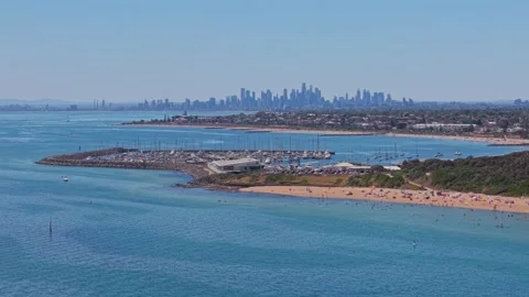 Aerial View of Sandringham Beach with Melbourne Skyline in Background Stock Footage 327889449