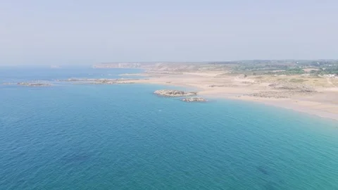 Aerial view of the sandy Anse du Croc beach and rugged coastline at Frehel Stock Footage 346722217