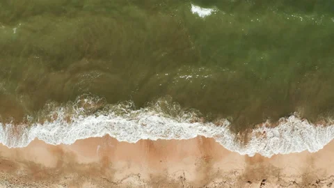 Aerial view of the sandy beach and sea waves. Vacation at sea. Stock Footage 148073302