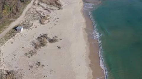 Aerial View of Sandy Beach and Turquoise Sea Waves Stock Footage 324529024