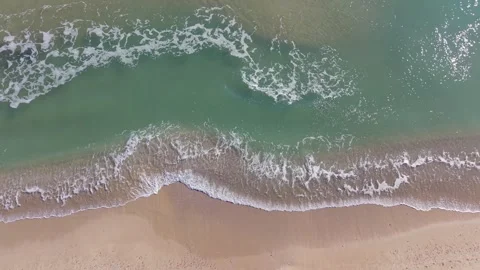 Aerial View of Sandy Beach and Gentle Waves Along Coastline Stock Footage 325720108