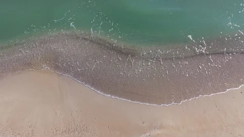 Aerial View of Sandy Beach and Gentle Waves Along Coastline Stock Footage 325720120